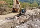 FOTO Au început lucrările pe DJ 127A, drumul rupt de apă la Valea Rece