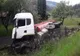 FOTO. Accident grav la Corbu. Bărbat lovit în fața porții de un camion răsturnat peste gard, în urma impactului cu un alt camion